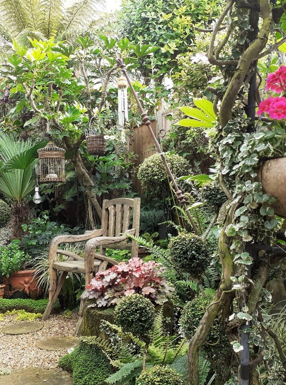 Tropical style garden with chair